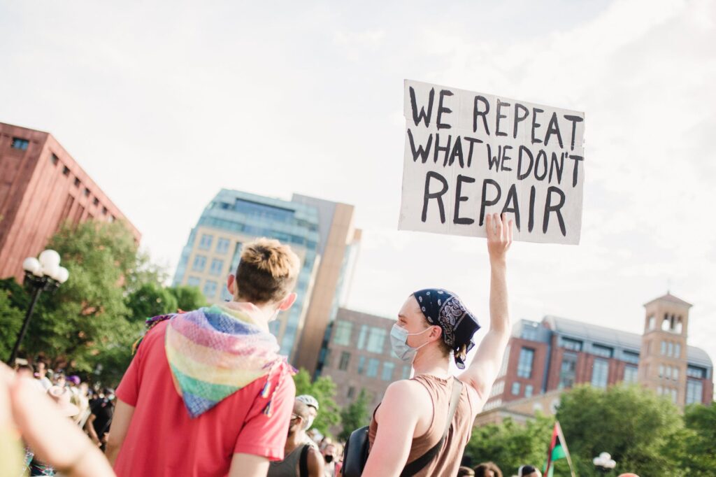 woman holding a sign at a protest
