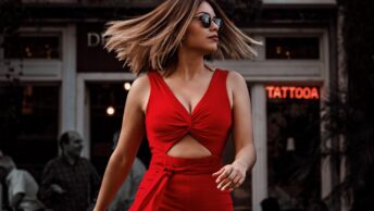 photo of woman in red outfit walking
