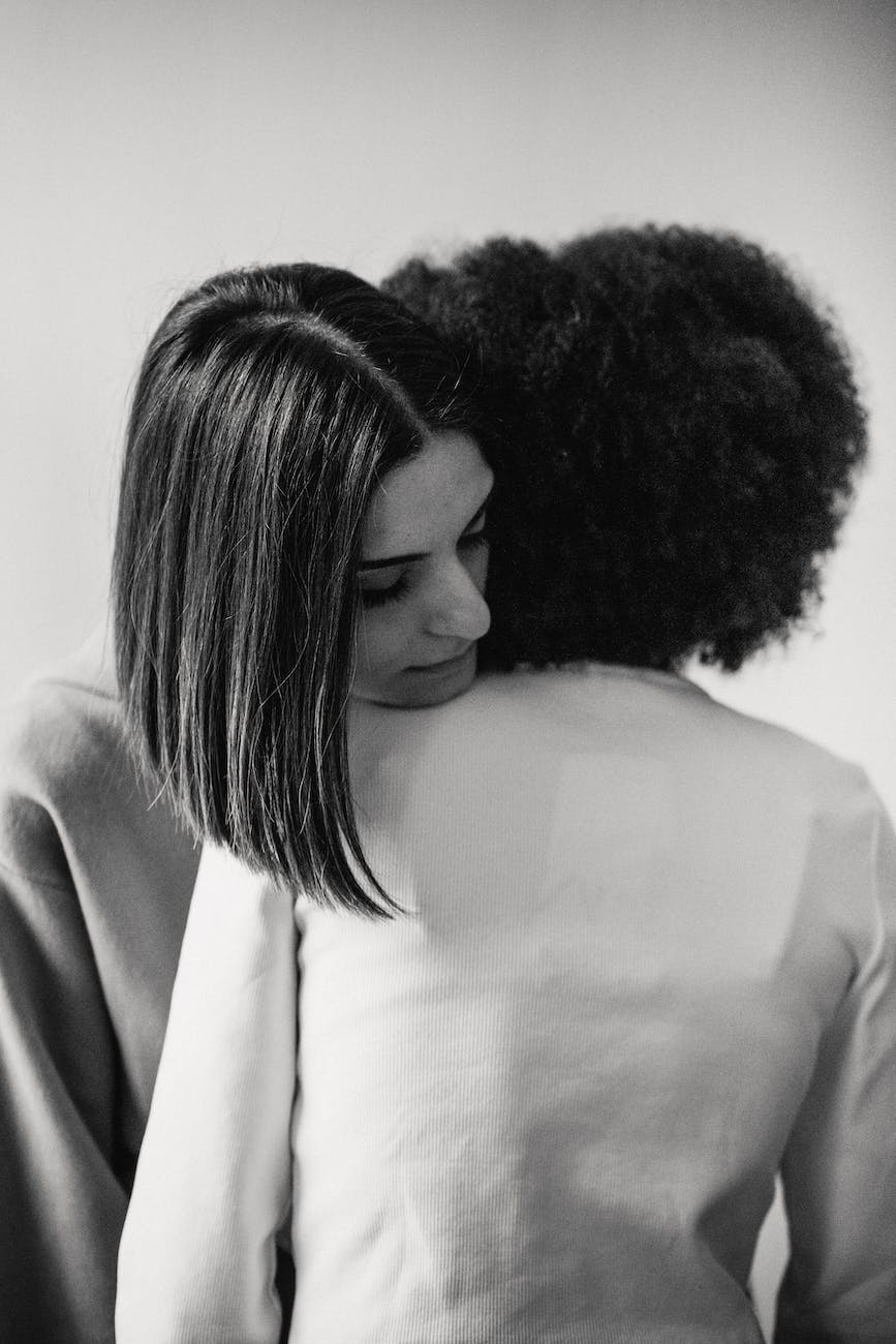 young women hugging after quarrel